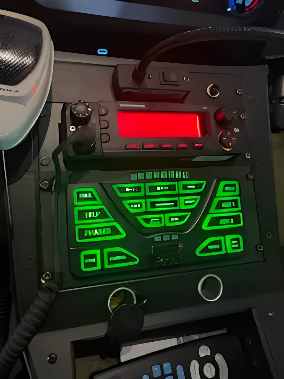 Control panel with illuminated green buttons.