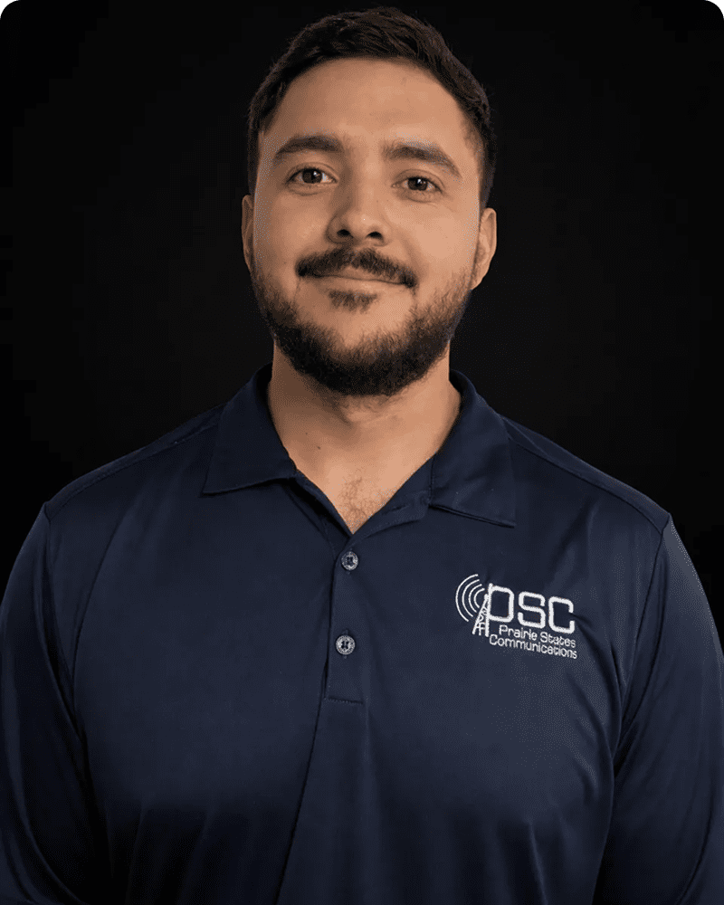 Man wearing a navy blue PSC shirt.